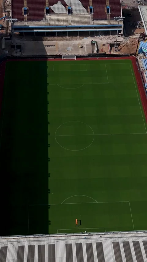 Aston Villa stadium demolition reverse reveal of cleared stand before the Stock Footage 344086002