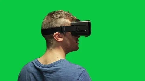 Astonished man with virtual reality headset on green screen Stock Footage 111345687