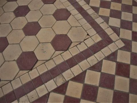 Astonishing floor pattern made of red and yellow hexagonal and square blocks Fotos Stock