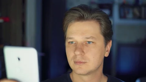 Astonishment, the man is using a mobile phone. Stock Footage 84564674