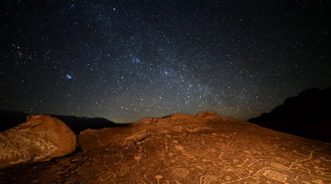 Astro Time Lapse of Starry Sky over Native American Petroglyphs -Zoom In- Stock Footage 61773038