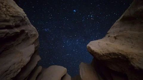 Astro Timelapse of Night Sky thru Canyon Walls in Mojave Desert -Tilt Down- Stock Footage 70873495