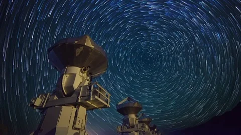 Astro Timelapse of Star Trails over Array of Radio Observatories -Long Crop- Stock Footage 69213804