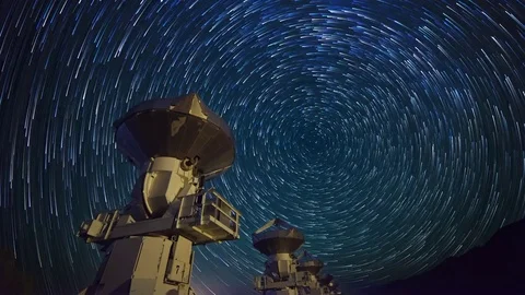 Astro Timelapse of Star Trails over Array of Radio Observatories  Stock Footage 69213878