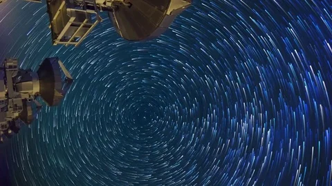 Astro Timelapse of Star Trails over Array of Radio Observatories -Vertical/Pan- Stock Footage 69213883