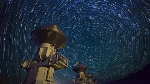 Astro Timelapse of Star Trails over Array of Radio Observatories -Zoom Out- Stock Footage 69213956