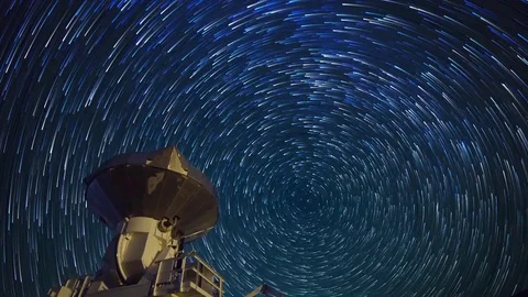 Astro Timelapse of Star Trails over Array of Radio Observatories -Tilt Up- Stock Footage 69214055