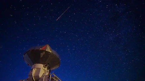 Astro Timelapse of Starry Sky over Array of Radio Observatories -Tilt Down- Stock Footage 69214275