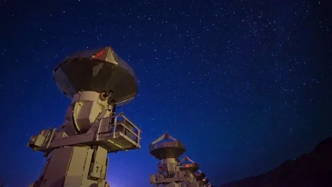 Astro Timelapse of Starry Sky over Array of Radio Observatories -Tilt Up- Stock Footage 69214312