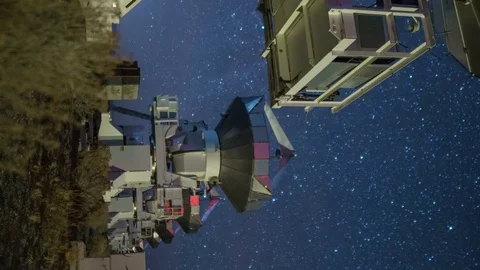 Astro Timelapse Tracking Shot of Starry Sky over Radio Telescope Array -Vertical Stock Footage 85202691