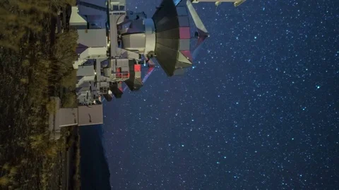 Astro Timelapse Tracking Shot of Stars over Radio Telescope Array -Vertical/Pan- Stock Footage 85208043