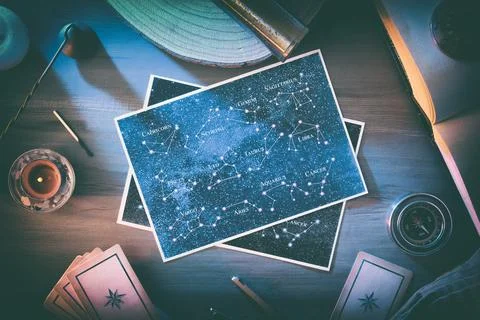 Astrological background of study and forecast with maps on table 写真素材