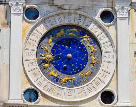 Astrology clock on the side of St. Marco square Stock Photos