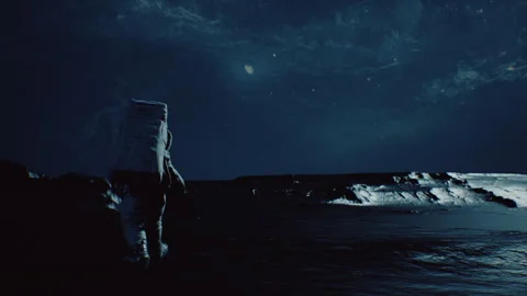 An Astronaut On Alien Planet walking carefully in poorly lit environment Stock-Footage 240311629