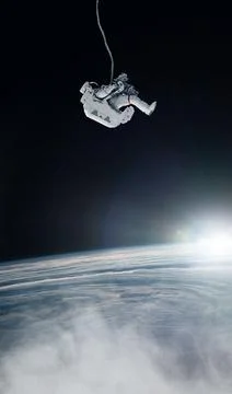 Astronaut and earth background. Elements of this image furnished by NASA. Stock Photos
