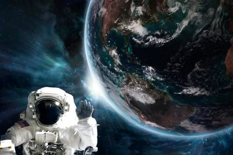Astronaut and the earth "Elements of this image furnished by NASA" Stock Photos