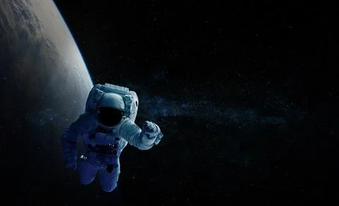 Astronaut and space background. Elements of this image furnished by NASA. Stock Photos