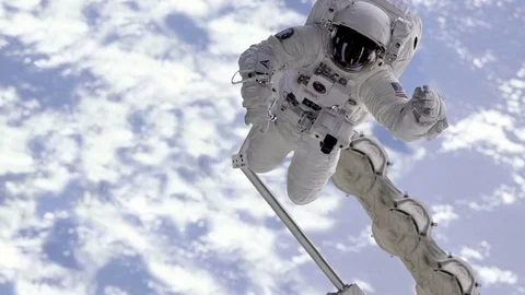 Astronaut are moving in the camera in outer space Video stock 74494536