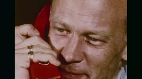 Astronaut Buzz Aldrin talking on phone Stock Footage
