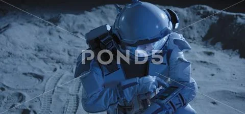 Astronaut checking his surroundings on Moon Stock Photos