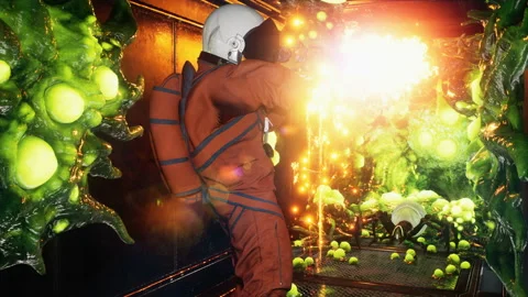 An astronaut clears the corridor of a spaceship of alien creatures with a Stock Footage 239325015
