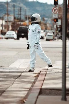 Astronaut crossing the street Stock Photos