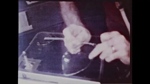 Astronaut demonstrate behavior of liquid space in zero gravity - 1970 Video stock 105754729