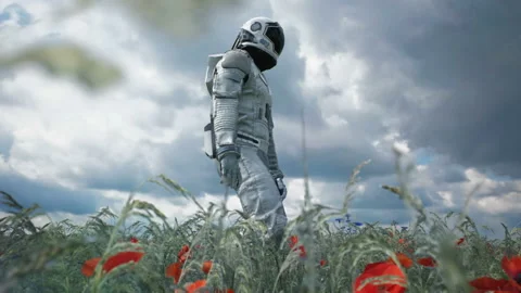 An astronaut-Explorer is walking on a blooming planet. Animation for fantasy Stock Footage 137653741
