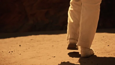 Astronaut explores Martian surface during pioneering mission in 2023 Stock Footage 287874767