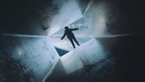 Astronaut falling down a bright path or a tunnel at zero gravity. Planet earth 스톡 동영상 219928682