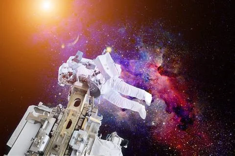 Astronaut floating in outer space. Elements of this image furnished by NAS... Stock Photos