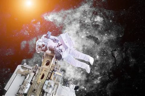 Astronaut floating in outer space. Elements of this image furnished by NAS... Stock Photos