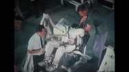 Astronaut In Full Spacesuit Sitting On Spacecraft Couch Stock Footage