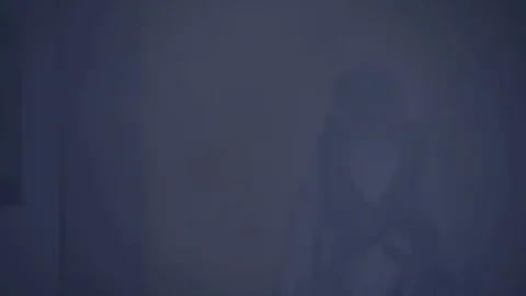 Astronaut in full white space suit and black visor walking in smoke filled Vidéo 118444411