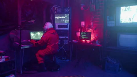 Astronaut Gets up from Working at Computer in Surveillance Room Walking Away Stock Footage 270333616