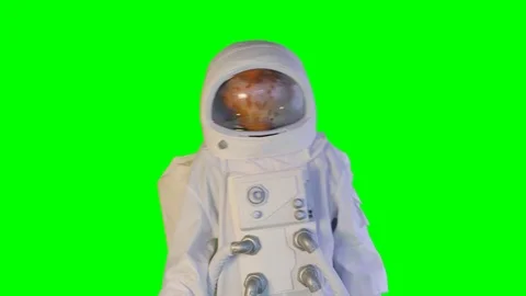 The astronaut goes forward on a green background Stock Footage 109272152