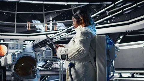 Astronaut inside high tech spacecraft checking red planet summary analytics Stock Photos