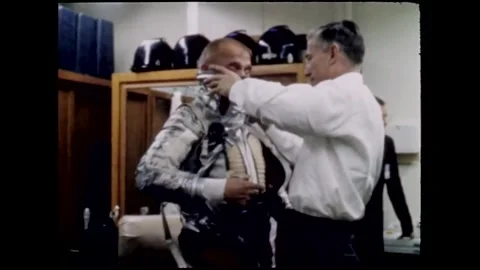Astronaut John Glenn dressing in space suit Stock Footage 262065257