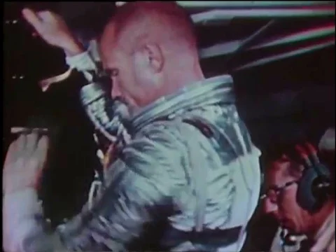 Astronaut John Glenn eats, has medical sensors attached to his body, suits up 動画素材 79458547