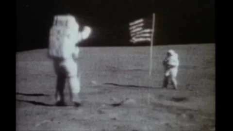 Astronaut John Young jumping on the moon during Apollo 16 lunar landing mission Stock Footage 270937595