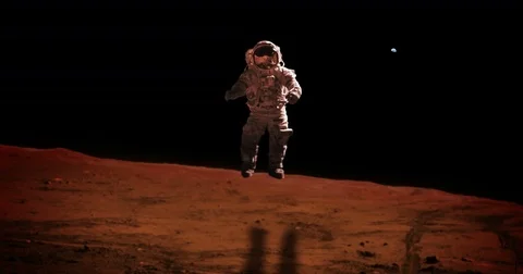 Astronaut Jumping on Mars Surface on Missions in Far Earth Distance Stock Footage 76890491