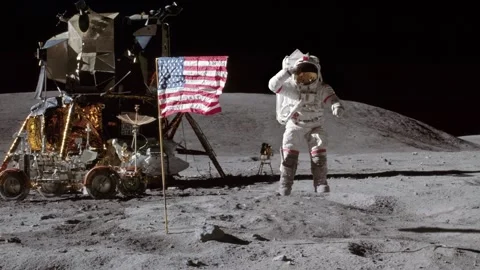 Astronaut Jumping on the Moon's Surface near the American Flag 動画素材 249889712