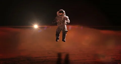 Astronaut Jumps on Mars Surface Exploration Mission Blur Background Stock Footage 76890669