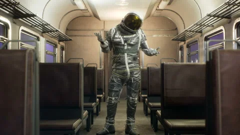 The astronaut makes a questioning gesture, in an interstellar space train Vidéo 169352997