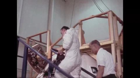 Astronaut Michael Collins ascending steps and climbing into command module Stock Footage 269506628