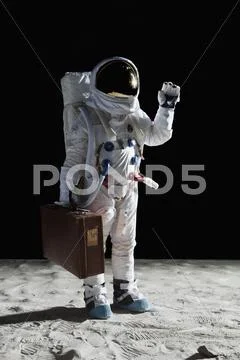 An astronaut on the moon carrying a suitcase and waving Stock Photos