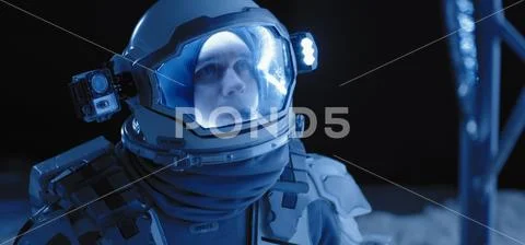 Astronaut on the Moon looking around Stock Photos
