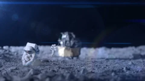 Astronaut on the moon surface.  The lunar lander is blurred in the distance and Stockbeeldmateriaal 32963129