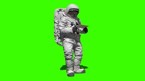 Astronaut on the moon typing on a laptop with a green screen. Stock Footage