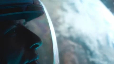 Astronaut with nebula and galaxies in space. Reflection of planet earth. Milky Stock Footage 282860751
